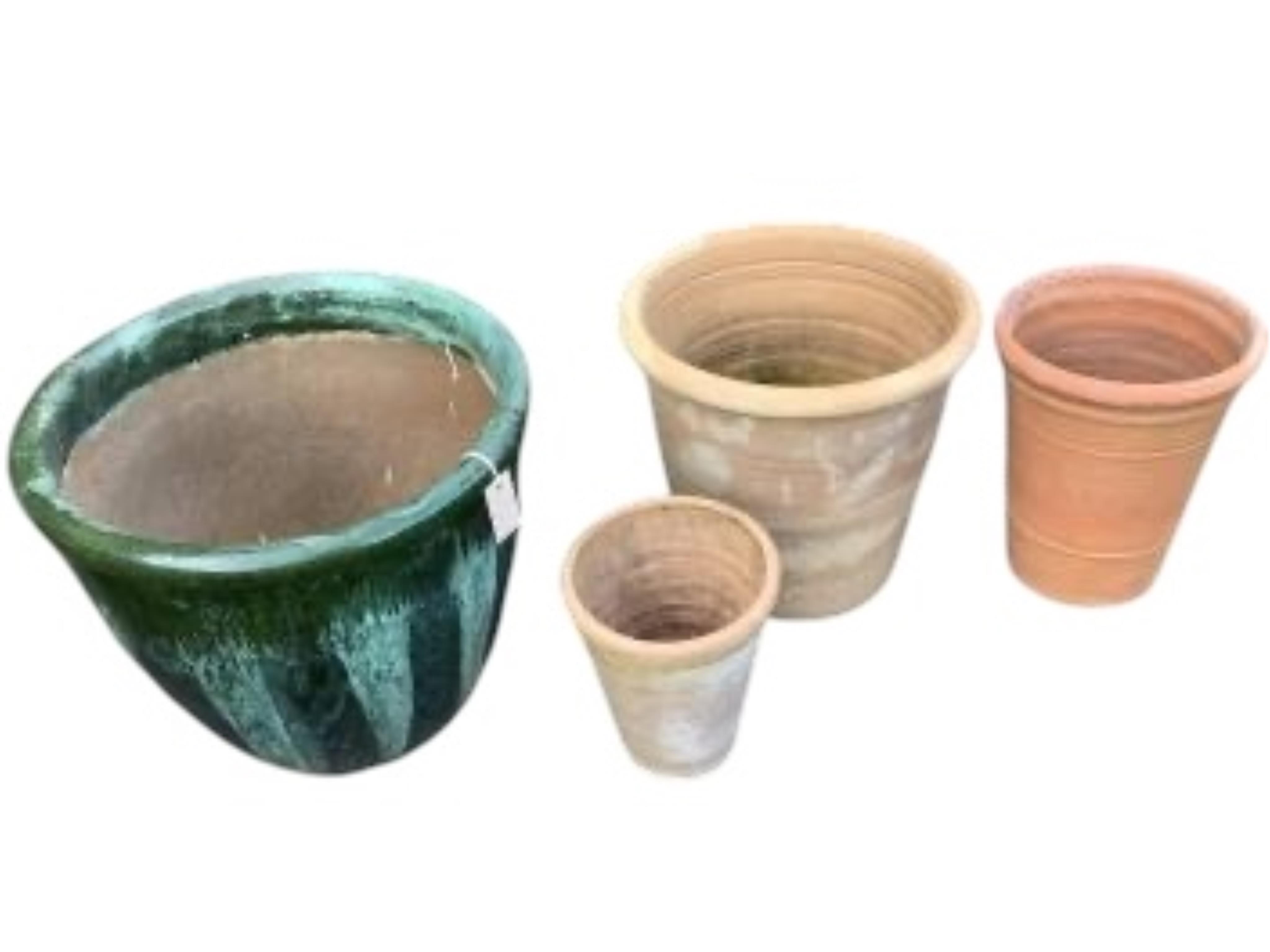 Three circular terracotta garden planters, largest diameter 49cm, height 41cm